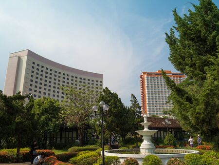 building with blue sky in background and garden in foregroundのeditorial素材