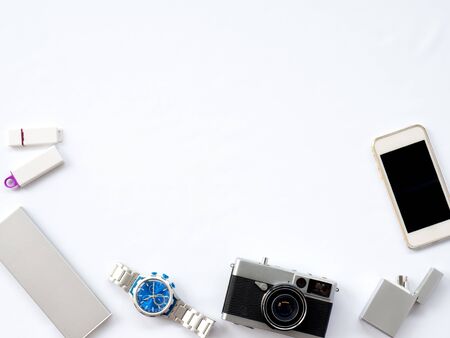 Flat Lay, Technology Photo, Smart Device Photo with props are smartphone, Watch, power bank, charger, camera and flash drive  situate untidy on white background or isolated with spaceの写真素材