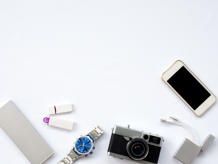 Flat Lay, Technology Photo, Smart Device Photo with props are smartphone, Watch, power bank, charger, camera and flash drive  situate untidy on white background or isolated with spaceの写真素材