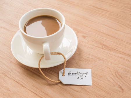 Coffee cup over old wooden background