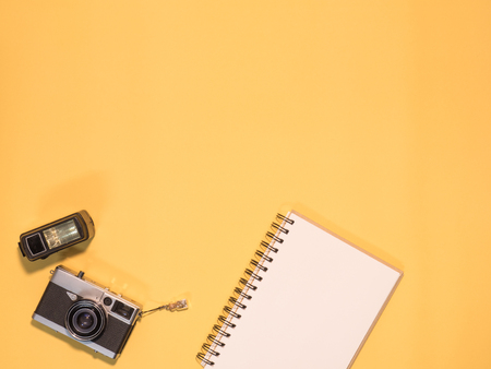 Flat Lay, Top View of Camera and photography tool on yellow background with spaceの写真素材