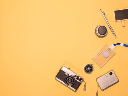 Flat Lay, Top View of Camera and photography tool on yellow background with spaceの写真素材