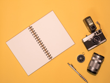Flat Lay, Top View of Camera and photography tool on yellow background with spaceの写真素材