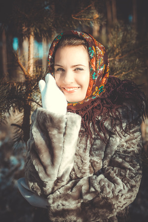 Beautiful young woman in traditional headdress smilesの写真素材
