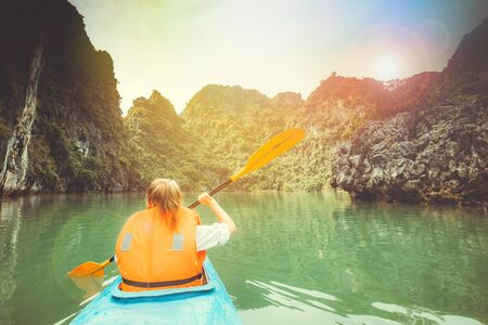 Towards to adventures in a kayak in the picturesque Halong Bayの写真素材