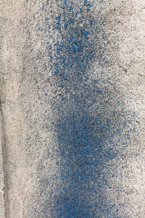 Drops of molten metal on a concrete wallの写真素材