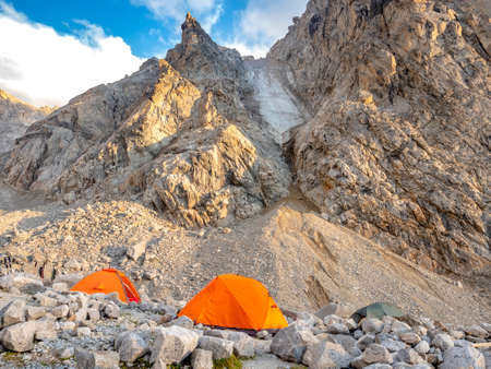 Tent camp at the foot of the cliffs of the Northern Massif Main Caucasian ridgeの写真素材