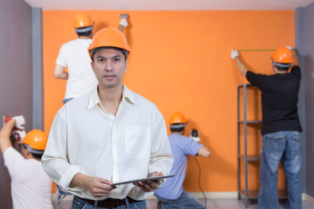 Asian handsome architect with workers. Home improvement, Renovation set. asian craftsman team...