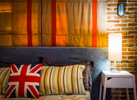 lamp on night table next to bed, cozy living. bedroom interiorの写真素材