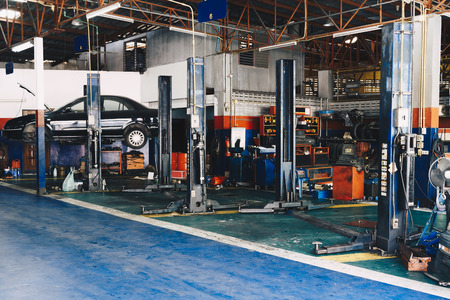 car on lift in car repair station