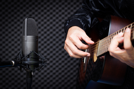 condenser microphone recording acoustic guitar in studioの写真素材