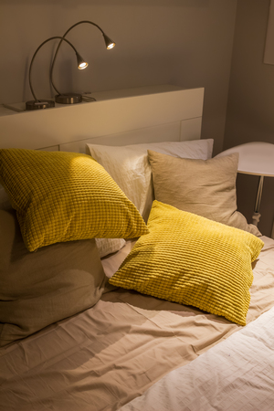 cushion and pillow on bed, cozy bedroomの写真素材