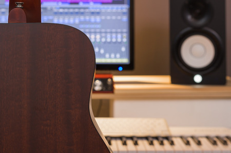 back of acoustic guitar in recording studioの写真素材
