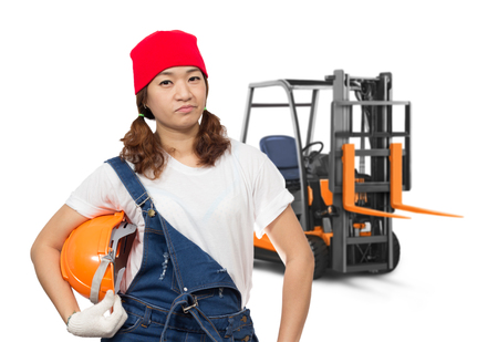 asian beautiful confident female craftsman with forklift truck, isolated on whiteの写真素材