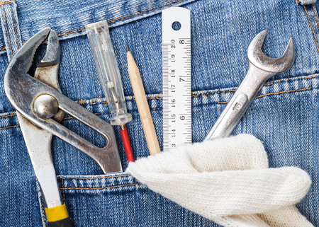 work tools in jeans pocket