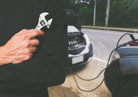 car service, repair, maintenance concept. low batteryの写真素材