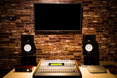 digital sound mixer, monitor speakers & LED screen in recording studio. music productionの写真素材