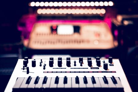 keyboard synthesizer in recording studio, shallow dept of field. music backgroundの写真素材