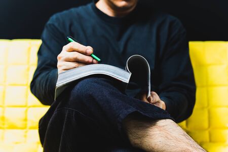 man reading a magazineの写真素材