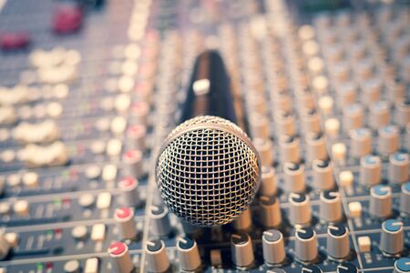 dynamic microphone on audio mixing console. broadcasting, recording conceptの写真素材