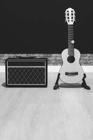 acoustic guitar and amplifier. black and white. music backgroundの写真素材