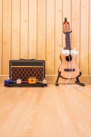 acoustic guitar, amplifier, effect pedal. music concept
