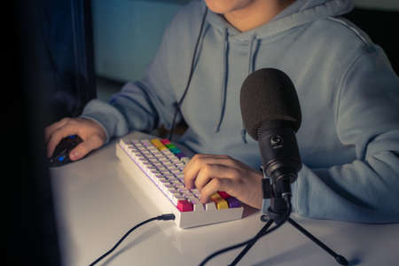 Video game streamers playing on their home console. Teenager playing computer gaming. Teen using...