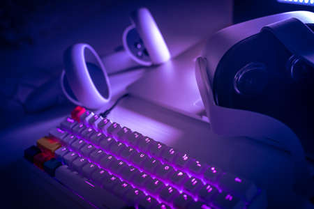 Virtual reality devices on the desk. Laptop VR 3D viewer air joystick and multimedia keyboard....