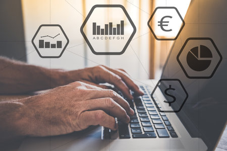 Hands typing on laptop keyboard. Charts, financial icons. Business performance, strategy and company...