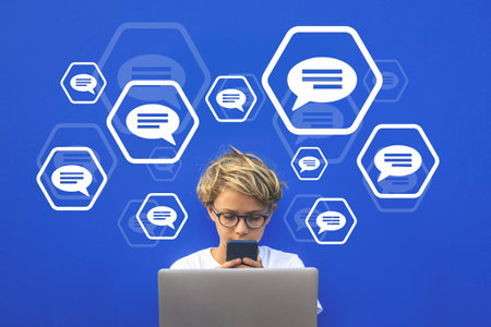 Teen chat concept. Communication with smartphone and computer. Adolescent online internet contactの写真素材