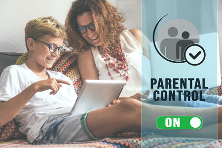 Parental control and child protection concept. Boy and mum typing on keyboard. Online content filterの写真素材
