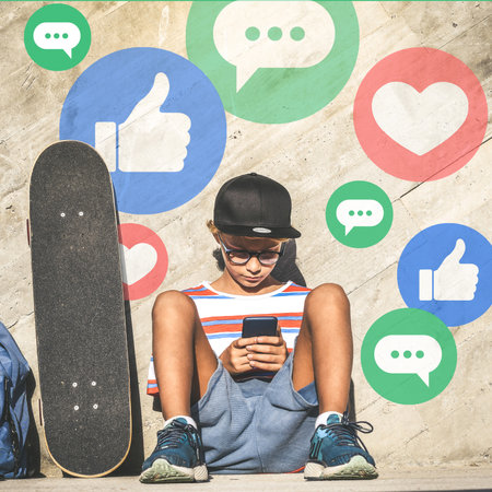 Young boy using smart phone. Smartphone in hands. Community, social media, communication concept.の写真素材