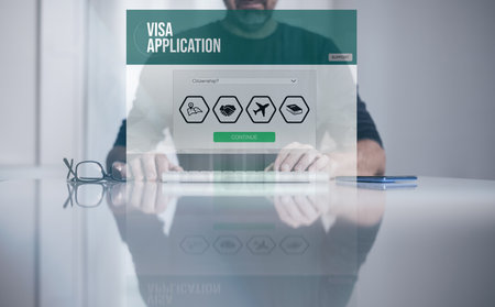 Man filling visa application form on laptop. Work recruitment, study, travel, immigration concept.の写真素材