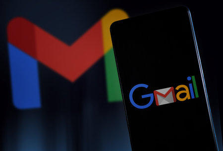 Google Gmail logo on smartphone screen and background. Milan Italy January 2023