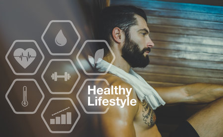 Portrait of beautiful young bearded man relaxing in sauna. Healthy, wellness lifestyle, spa conceptの写真素材
