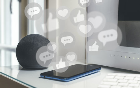 Smartphone, wifi speaker and computer on desk. Social media icons. Community, communication concept
