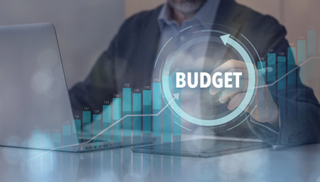 Businessman use laptop to plan and calculate budget. Corporate financial investment planning conceptの写真素材