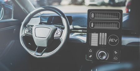 New EV car interior. Display shows charging hybrid battery of electric vehicle. Carbon free conceptの写真素材