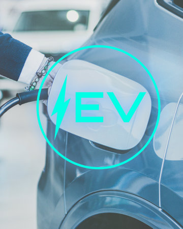 Man charging hybrid EV. Charge battery of electric vehicle. Eco carbon free technology conceptの写真素材