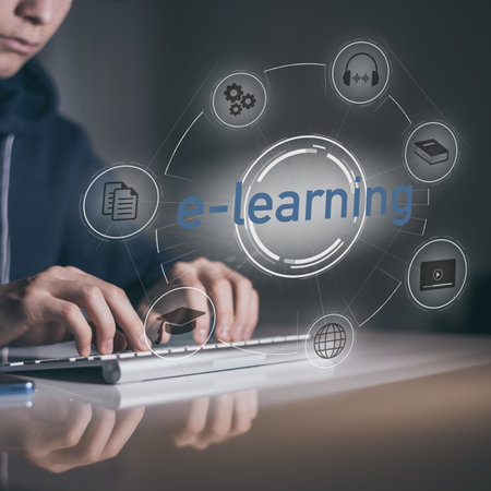 E-learning, education, study online concept. Boy typing on keyboard. E-learning on virtual displays.の写真素材