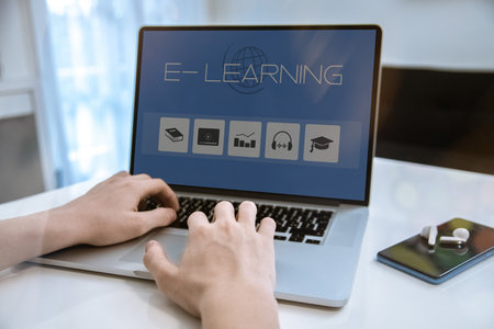 E-learning, education, study online concept. Boy typing on keyboard. E-learning on laptop display.の写真素材