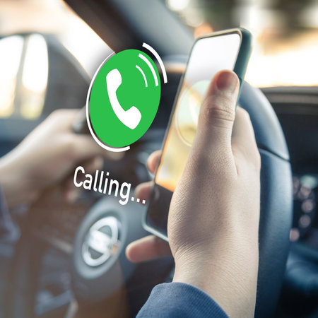 Teenager receiving a phone call while driving a car. Security, technology, communication concept.