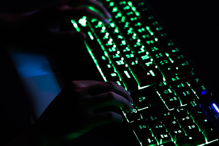 Playing computer game with gaming gear.の写真素材