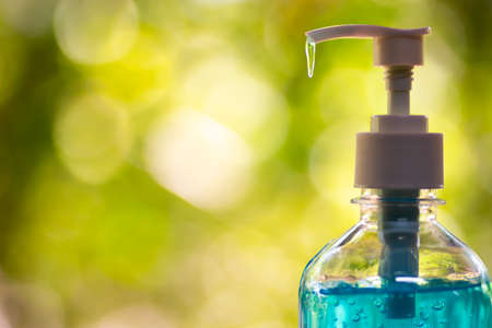 Man using alcohol gel clean wash hand sanitizer anti virus bacteria.の写真素材