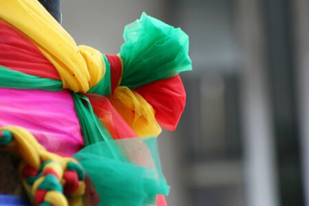 Close-up view of tie fabrics three colors at tree for religion beliefの写真素材