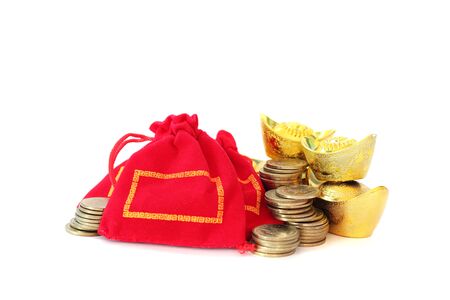 Ancient Chinese golden ingots, gold coins and Chinese lucky red bag on white background, Chinese new year ornamentの写真素材