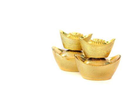 Ancient Chinese golden ingots on white background, Chinese new year ornamentの写真素材