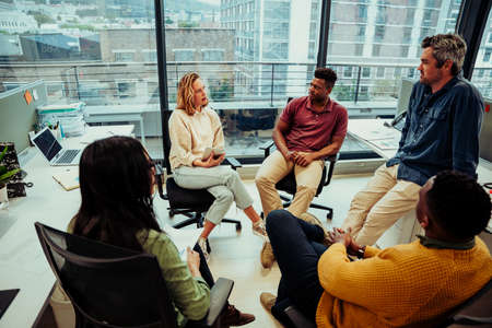 Diverse team of entrepreneurs discussing ideas for new project for new company, preparing for...