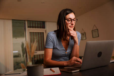 Caucasian female working from home studying for examsの写真素材