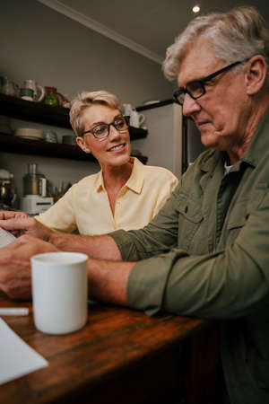 Caucasian senior couple working from home together